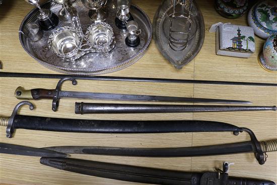 Three late 19th century French bayonets, a US Army bayonet, an EFD 1892 bayonet and an epee